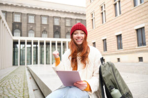 “Online student taking a free digital marketing course on a laptop for international job opportunities”